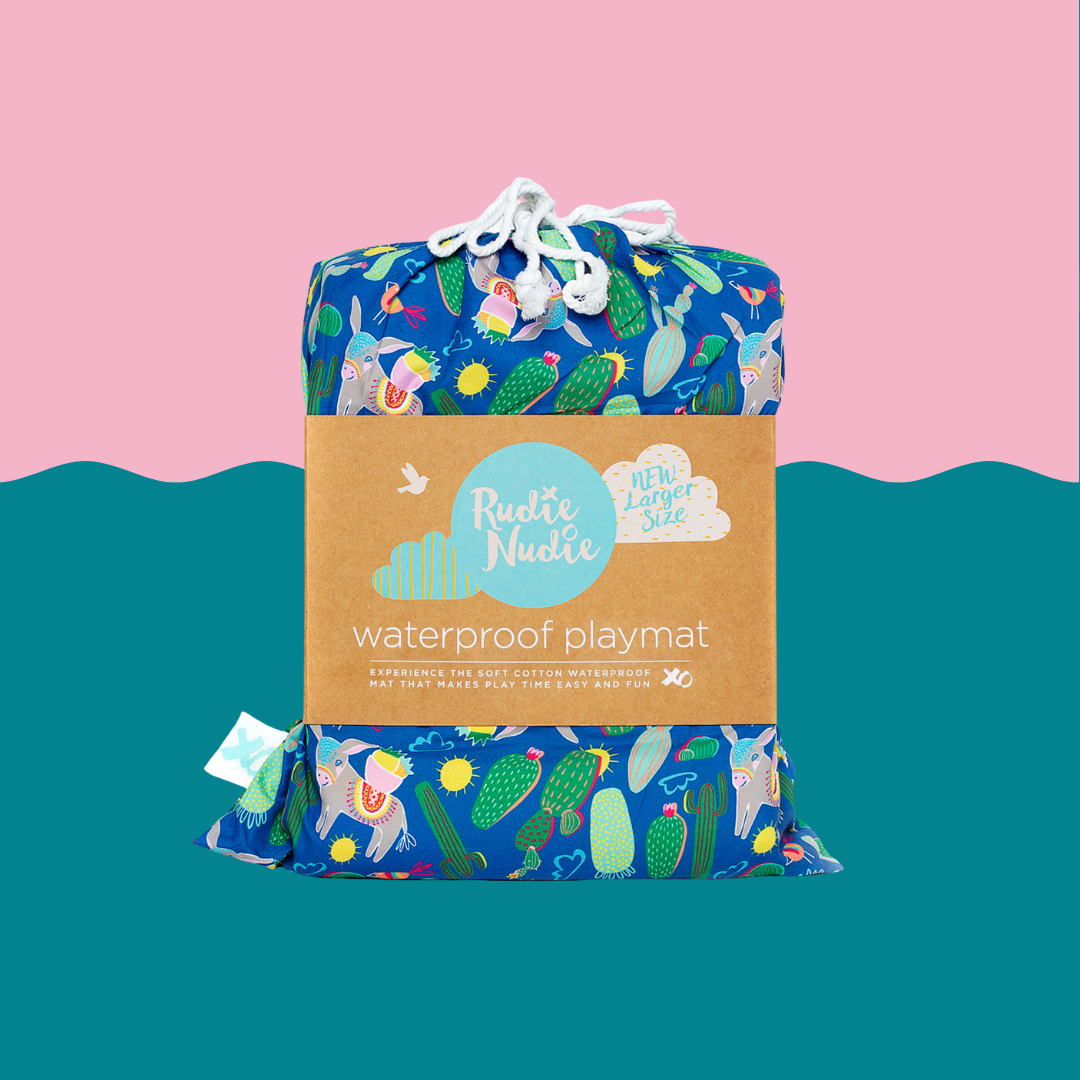 blue tropical print rudie nudie waterproof playmat folded in its branded drawstring carry bag