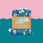 blue tropical print rudie nudie waterproof playmat folded in its branded drawstring carry bag