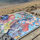 octopus's garden waterproof picnic blanket laid out on a timber deck by the beach